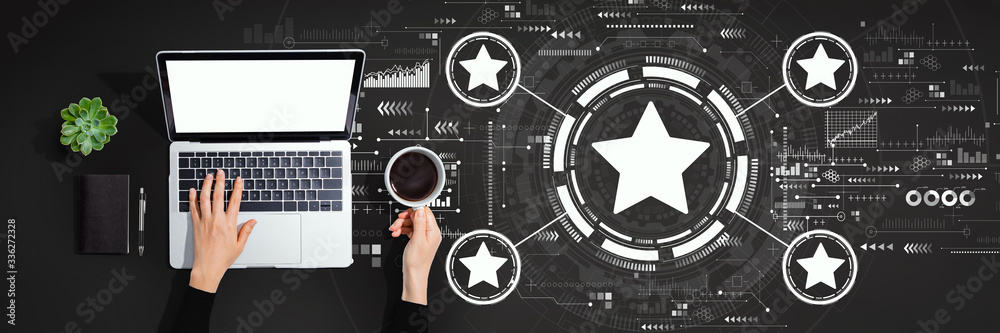Rating star concept with person using a laptop computer Rating star concept with person using a laptop computer