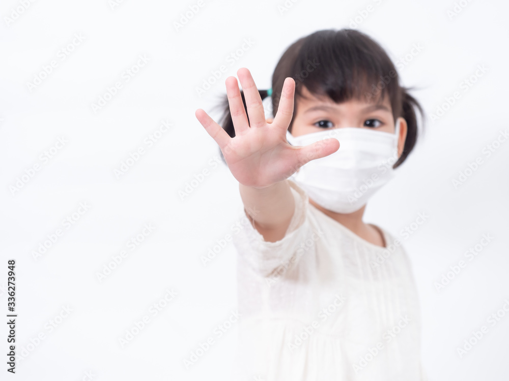 Asian little cute girl 4 years old wearing a hygienic mask and raising her hand to stop and protective spread the corona virus covid-19 cold flu or pollution on white background.
Asian little cute girl 4 years old wearing a hygienic mask and raising her hand to stop and protective spread the corona virus covid-19 cold flu or pollution on white background.