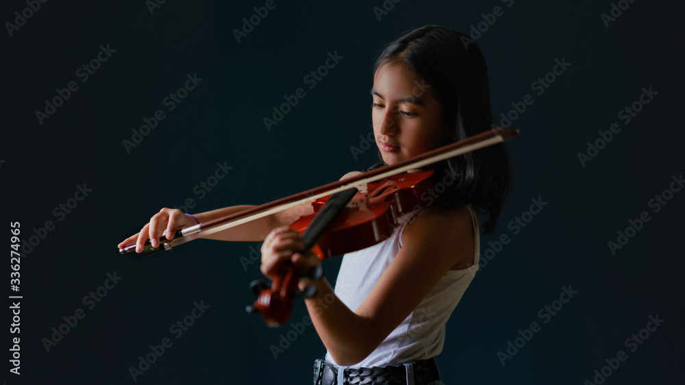 young woman playing violin time quaretiene pandemic time young woman playing violin time quaretiene pandemic time
