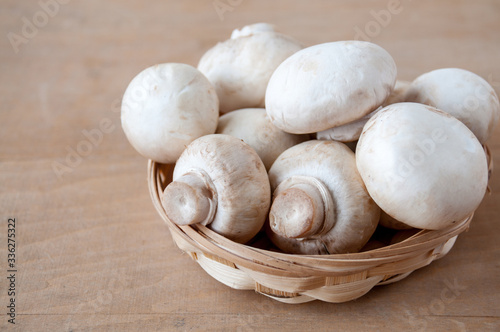 Mushrooms in a basket are on the table