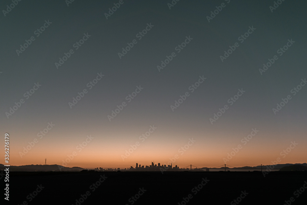San Francisco sunset from Alameda. City skyline, Sutro Tower and Bay Bridge views. San Francisco sunset from Alameda. City skyline, Sutro Tower and Bay Bridge views.