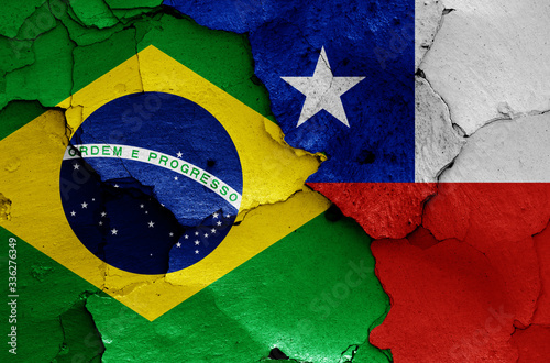 flags of Brazil and Chile painted on cracked wall