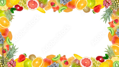 Creative photo of many different exotic tropical bright fruits frame isolated on a white background. View from above. Bright summer fruit pattern with copy space.