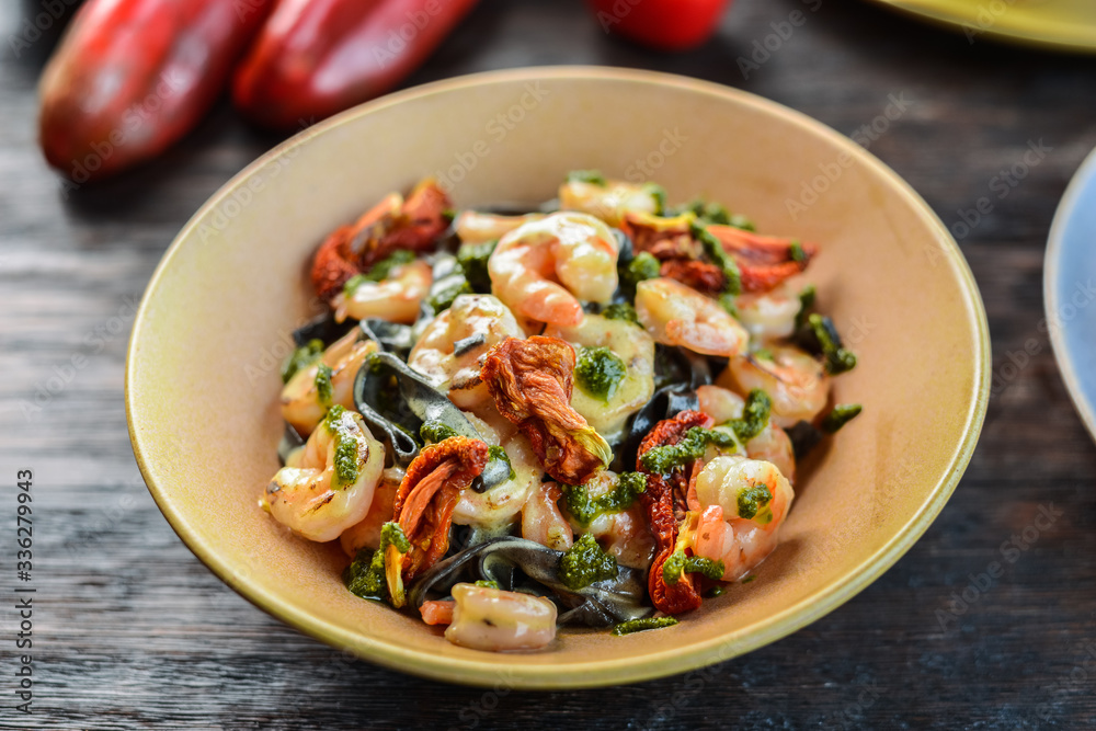 black ink pasta and grilled shrimps black ink pasta and grilled shrimps