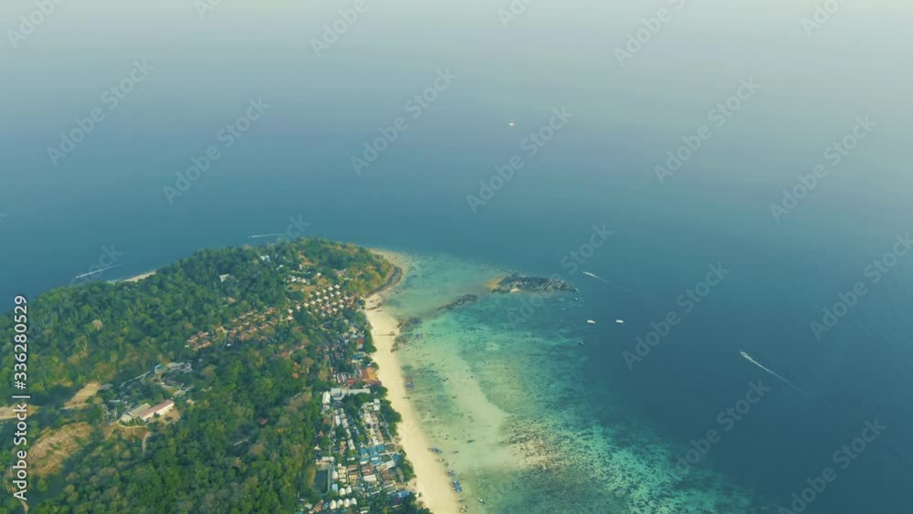 Aerial view of iconic tropical turquoise water Pileh Lagoon surrounded by limestone cliffs, Phi Phi islands, Thailand Aerial view of iconic tropical turquoise water Pileh Lagoon surrounded by limestone cliffs, Phi Phi islands, Thailand