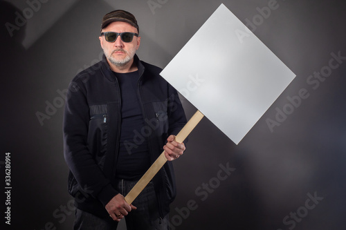 Man with a banner in his ha...