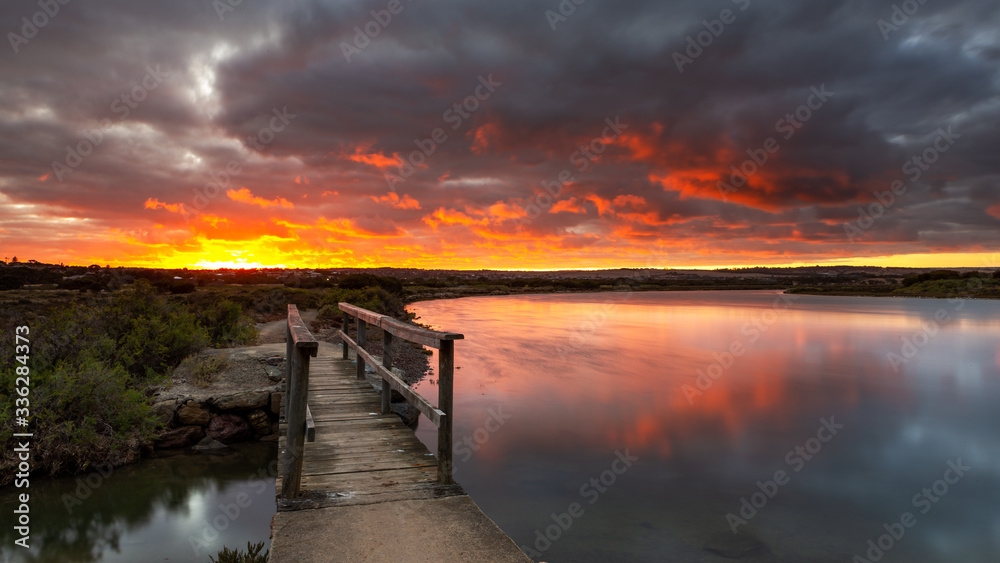 Plakat Sunrise over the small foot bridge located on the Onkaparinga River in Port Noarlunga South Australia on 30th March 2020