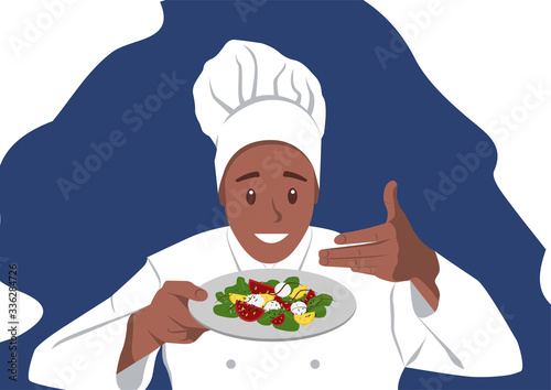 Smiling Dark-Skinned Chef is holding a Salad 