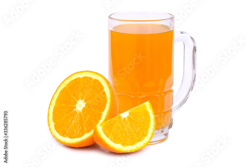 Closeup glass of fresh orange juice with slice of tangerine or mandarin orange fruit isolated on white background. 