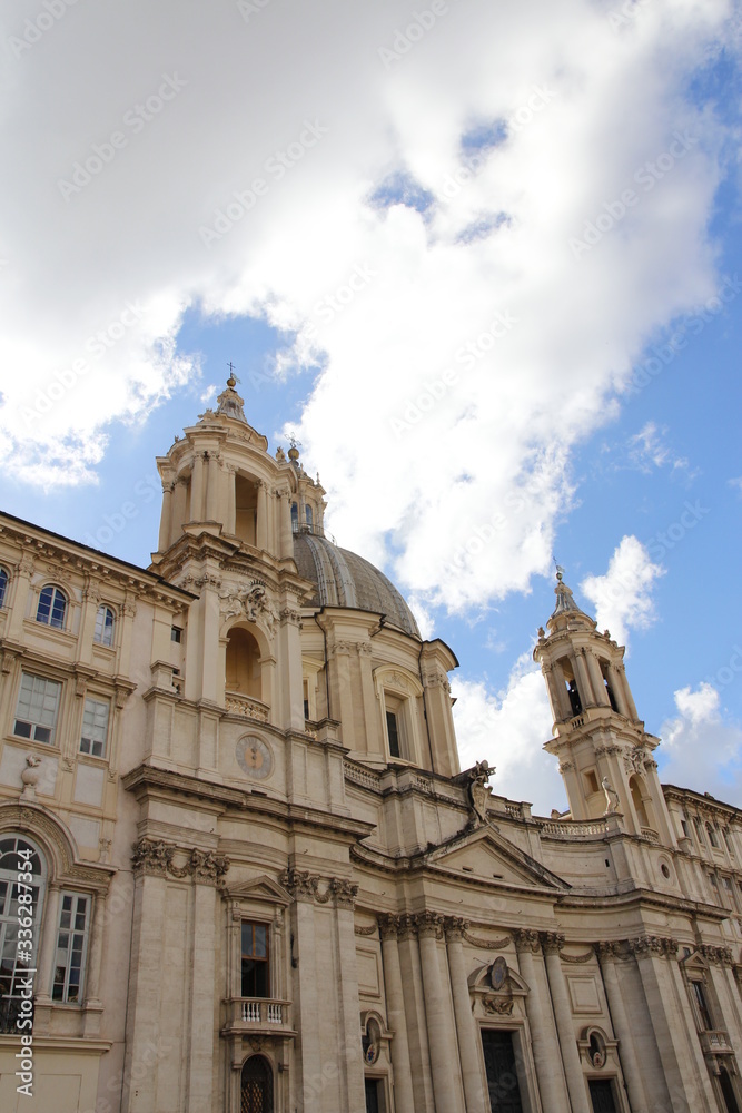 Sunny view of Piazza Navona with the blue sky and clouds in Rome, Italy