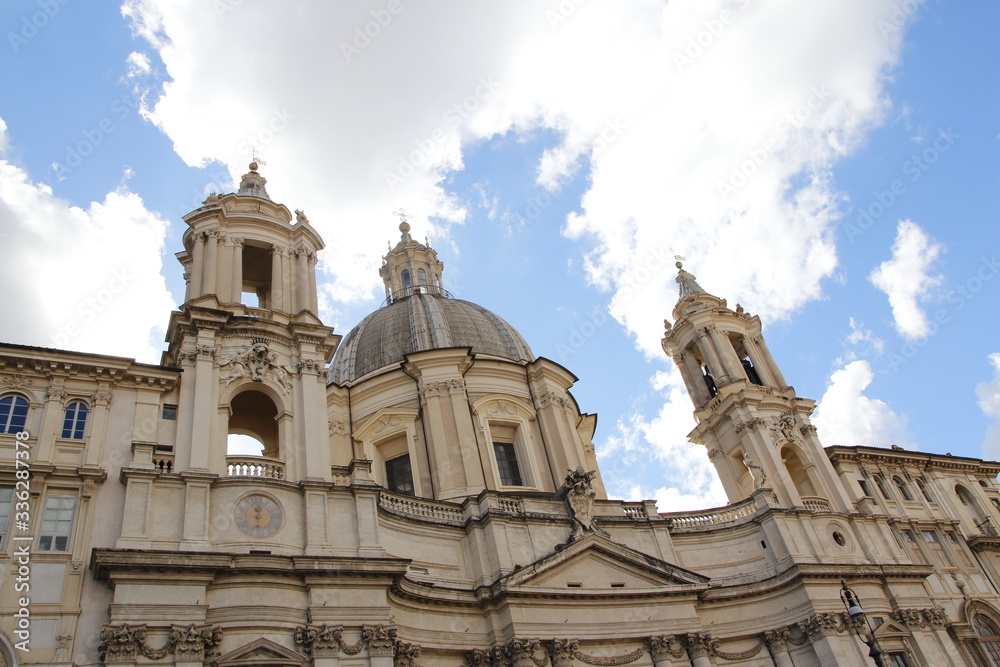 Sunny view of Piazza Navona with the blue sky and clouds in Rome, Italy