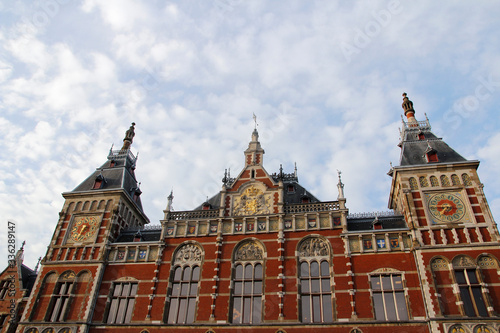 Front view of the Amsterdam Central (Centraal) Railway Station during sunset, Netherlands