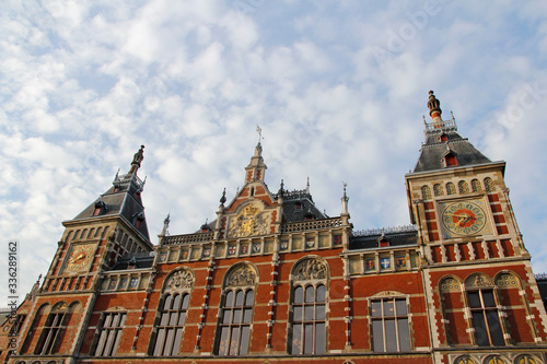 Front view of the Amsterdam Central  Centraal  Railway Station during sunset  Netherlands
