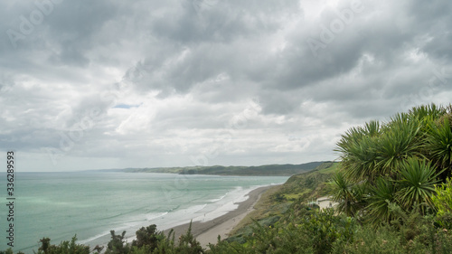 Fototapeta Naklejka Na Ścianę i Meble -  Remote tropical beach vista on overcast day, shot at Raglan, New Zealand