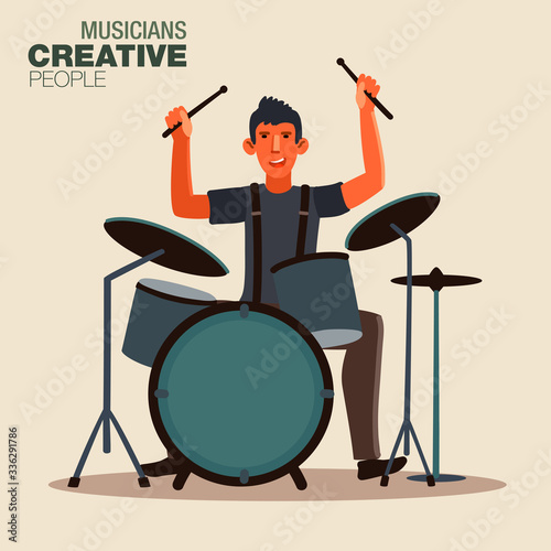 Young drummer of rock band playing his kit. Creative people