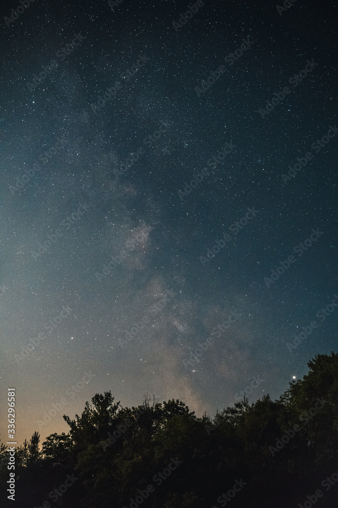 Image of the night sky with milky way, clouds, and stars Image of the night sky with milky way, clouds, and stars
