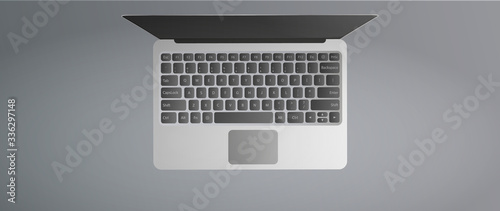 Modern laptop top view. Open laptop on a gray background. Realistic vector illustration.