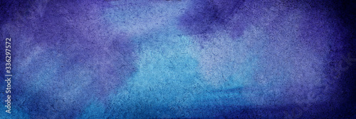 Abstract watercolor background in rich blue tones. Intense cobalt color with hints of lilac and light blue, turning into indigo. Hand-drawn illustration of twilight cloudless sky on textured paper