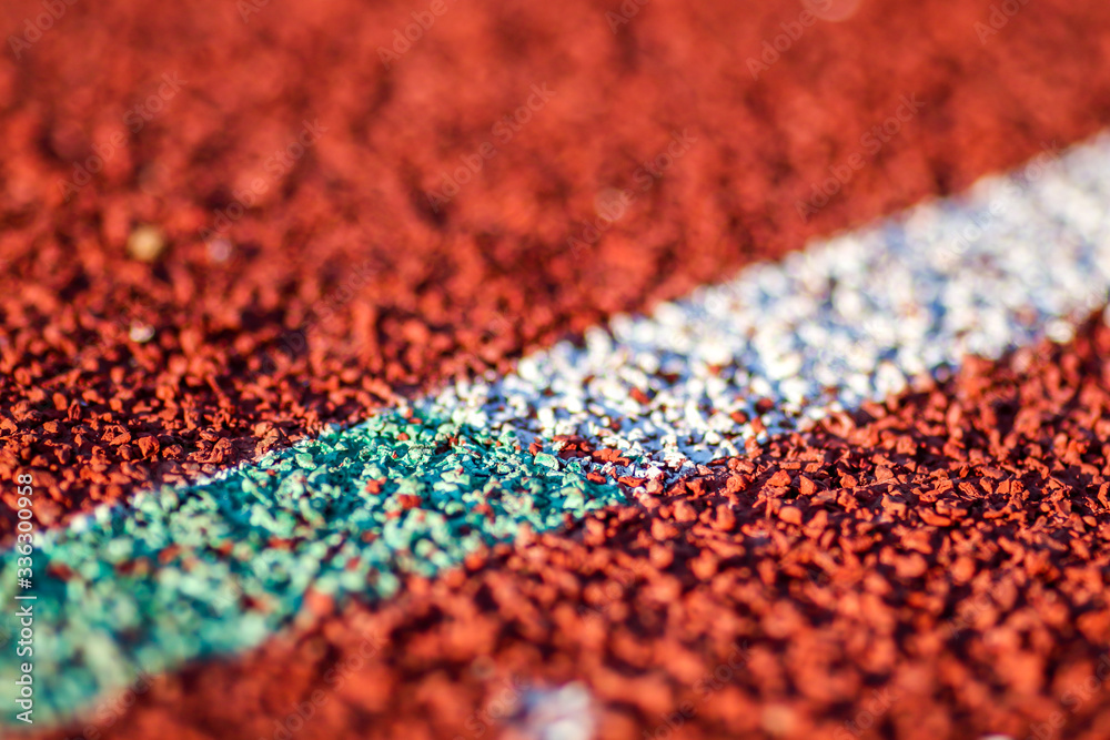 Red running sport track background and texture. Sport running track concept. Red running sport track background and texture. Sport running track concept.