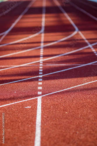 Fototapeta Naklejka Na Ścianę i Meble -  Red running sport track background and texture. Sport running track concept.