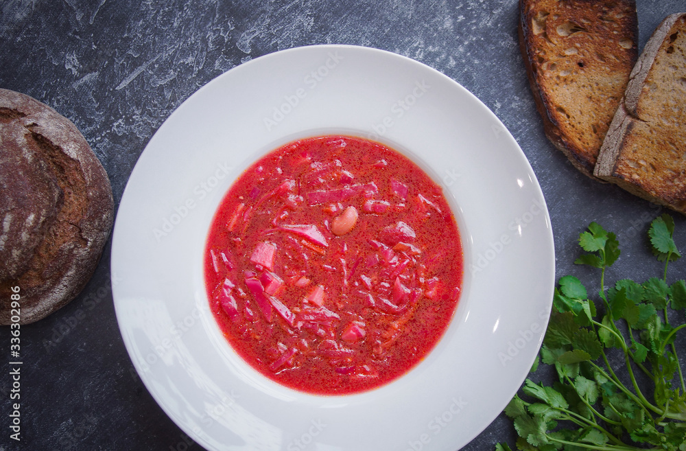 Borsch in a white plate, Menu, Russian cuisine recipe, Top view, Dark background Borsch in a white plate, Menu, Russian cuisine recipe, Top view, Dark background