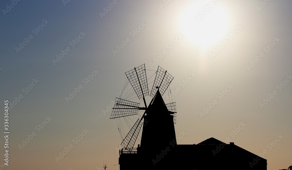 windmill silhouette with the setting sun