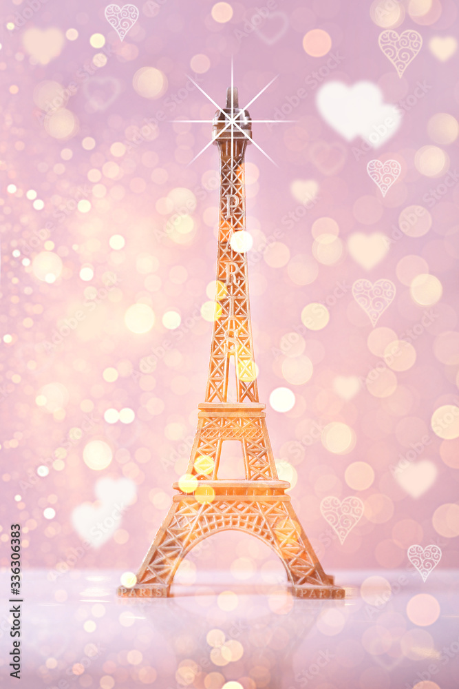 eiffel tower souvenir with pink bokeh shine  background and lights