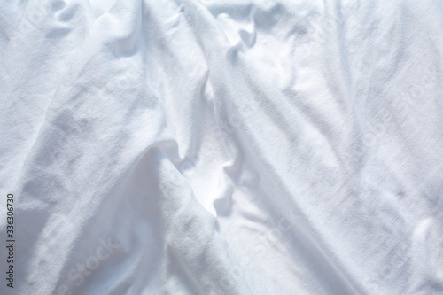 White bedsheet drying in the sun, Wrinkled texture, Abstract background, Close up shot, Selective focus, Housework, Laundry concept