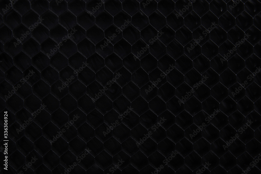 black honeycomb texture on a black background black honeycomb texture on a black background