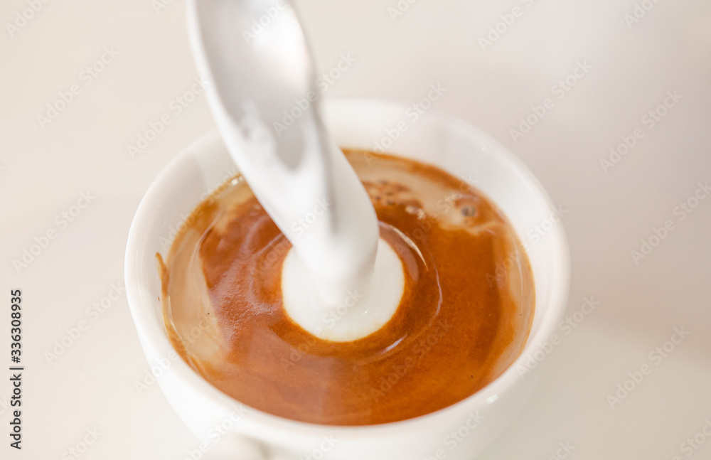Barista making a cup of coffee soft focus image Barista making a cup of coffee soft focus image