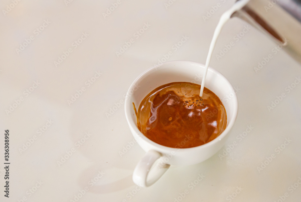 Barista making a cup of coffee soft focus image Barista making a cup of coffee soft focus image