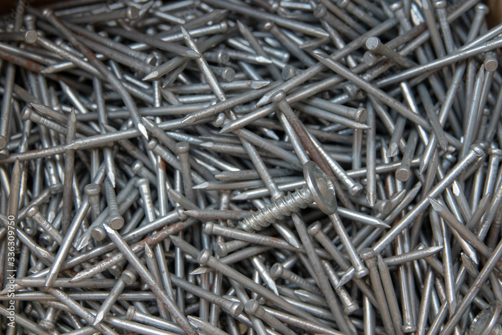 nails in a box on a wooden Board nails in a box on a wooden Board