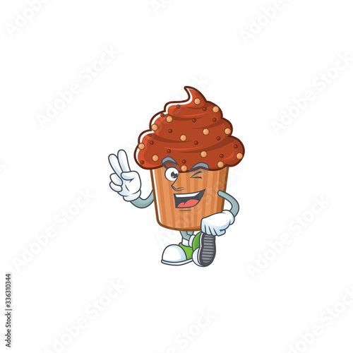 Cheerful chocolate cupcake mascot design with two fingers