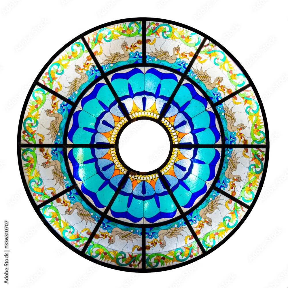 Decorative glass window mandala on the ceiling of Watugong Buddhist Temple in Semarang, Central Java, Indonesia; isolated on white background.