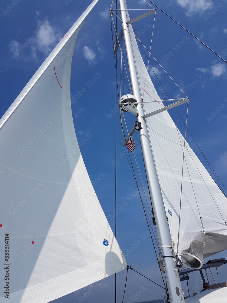 Obraz premium sail boat on blue sky