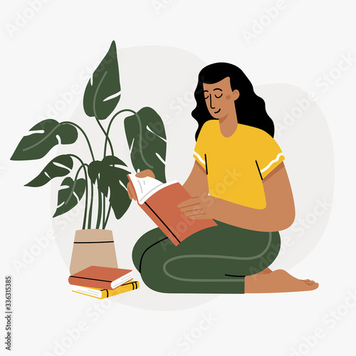 Girl reading a book and resting concept. Woman self isolation in her home 