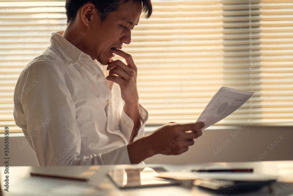 Fototapeta premium Business man stress and worry about late time to finish working project
