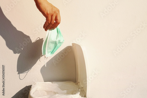 His hand picks up things without protection from germs. The disposal of surgical masks a used incorrectly, Because it is considered an infectious waste.