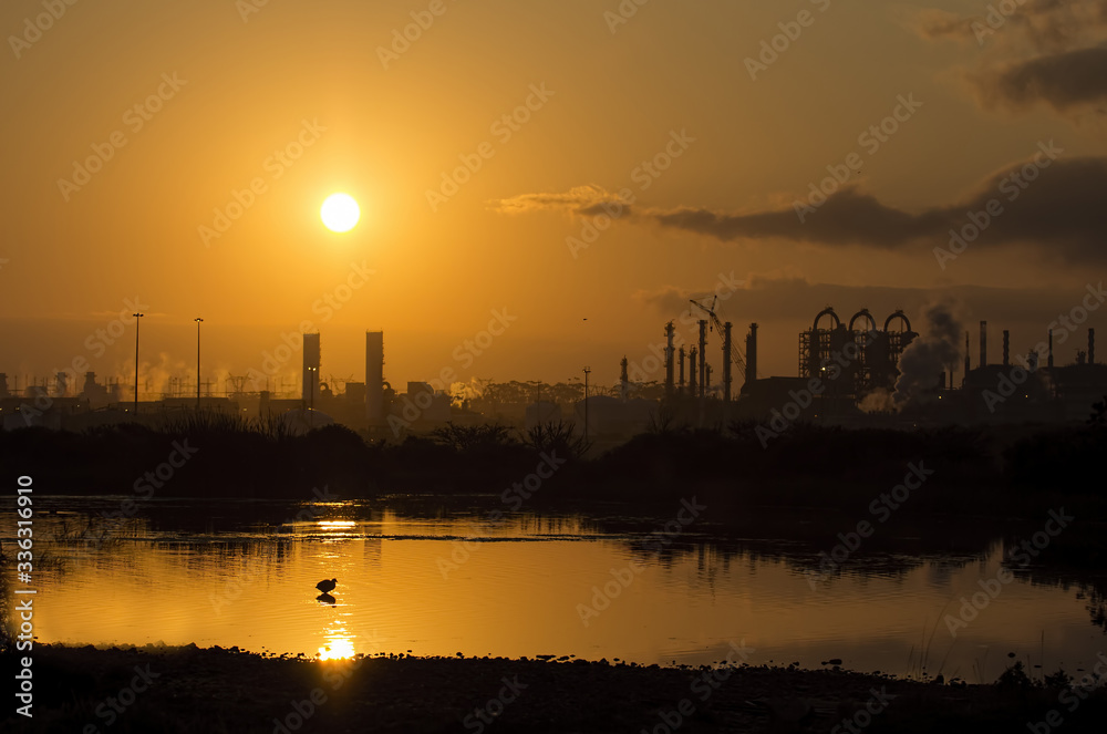Sunset over factory, industrial sight