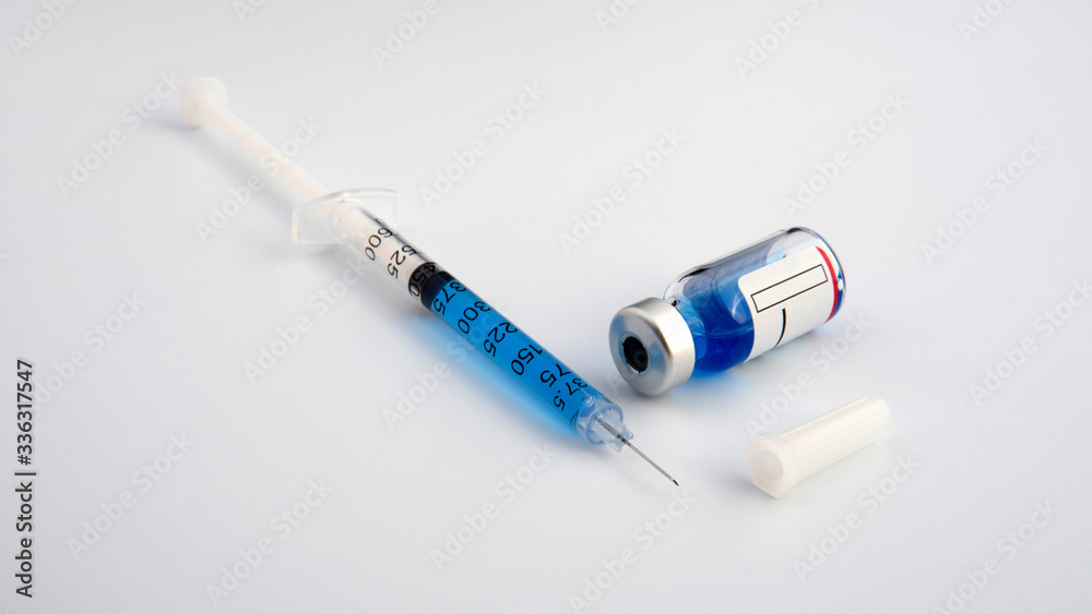 Close-up of a syringe and a vial of injectable solution Close-up of a syringe and a vial of injectable solution