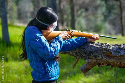 Woman Shooting Gun in California Forest - Springtime