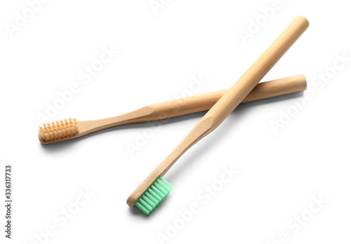 Wooden tooth brushes on white background