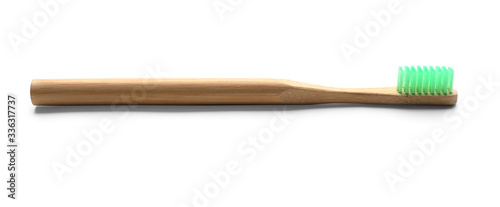 Wooden tooth brush on white background