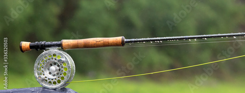 Fragment of a fly fishing rod with dew drops © salman2