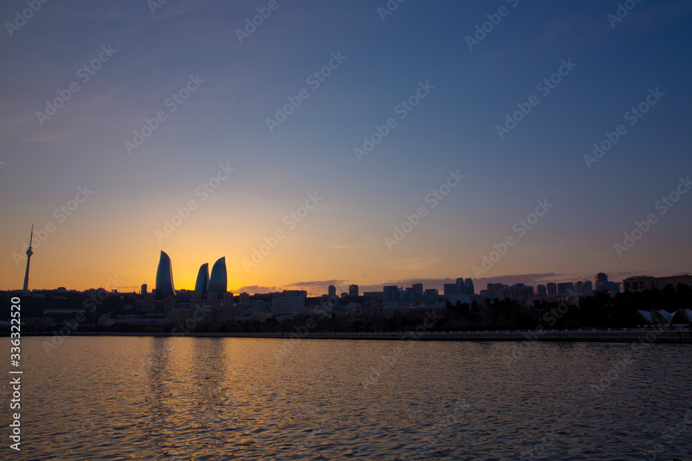 Naklejka premium Sunset of Baku, Azerbaijan . Fire towers in the night
