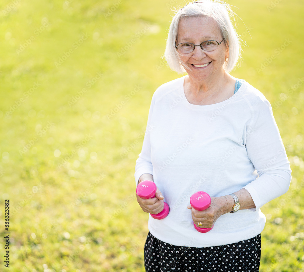 Senior woman doing sport and working out outdoors Senior woman doing sport and working out outdoors