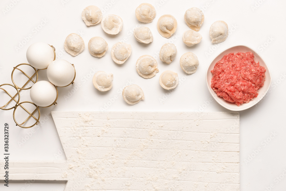 Preparing of tasty dumplings on white background Preparing of tasty dumplings on white background
