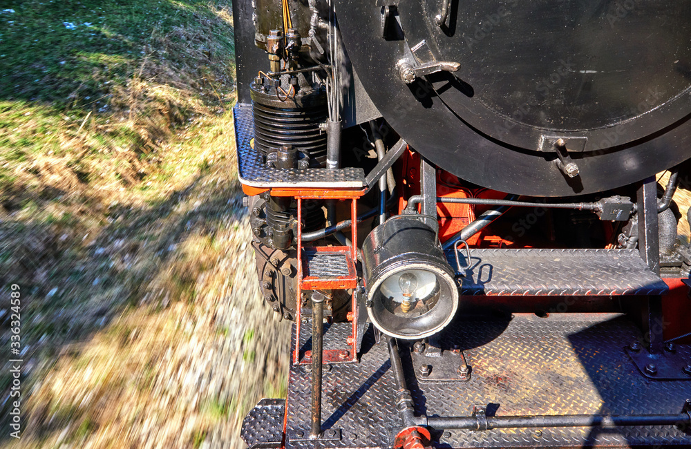 Detail of a steam locomotive while driving. Dynamics through motion blur.