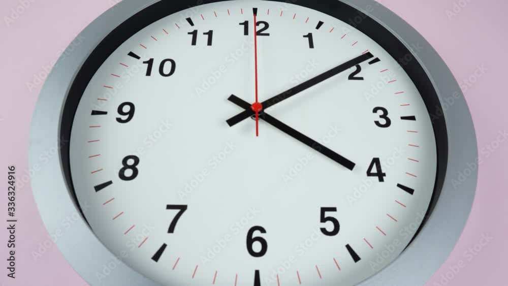 Closeup Gray wall clock shows time 4 o'clock, Time lapse moving fast, Time concept. Closeup Gray wall clock shows time 4 o'clock, Time lapse moving fast, Time concept.