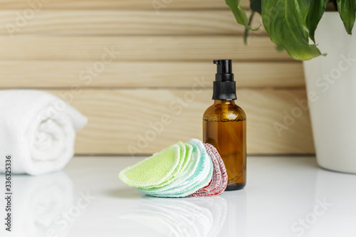 Behang Reusable Pads and bottle of cleanser or toner